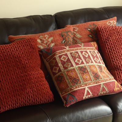 A Collection of Five Decorative Throw Pillows in Rust and Kilim Textiles