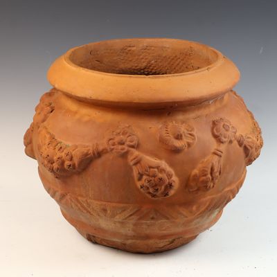 A Terracotta Garden Planter and Matching Hunting Dog Motif Thermometer