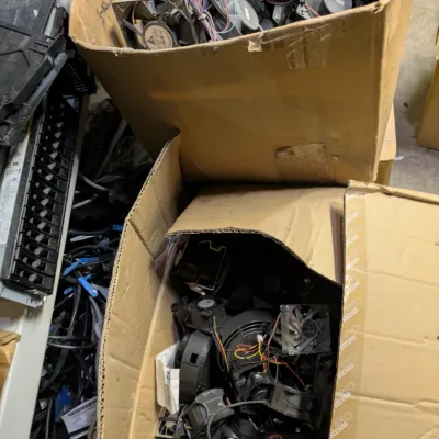Sale Photo Thumbnail #112: Two large cardboard boxes filled with an assortment of used computer cooling fans and blowers with attached wiring.