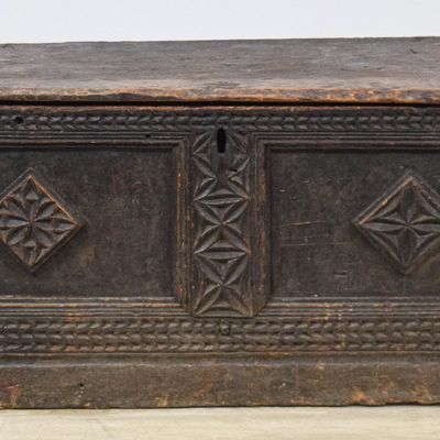 Sale Photo Thumbnail #66: 17th Century Carved Oak Blanket Chest With Bootjack Ends