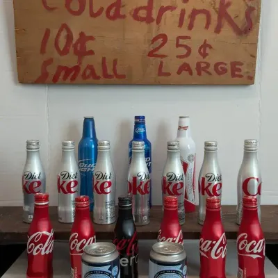 Aluminum Collectible Bottles and Primitive Sign