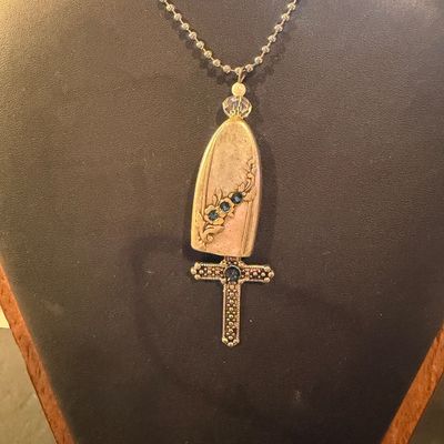 Vintage silver tone cross with blue rhinestone necklace