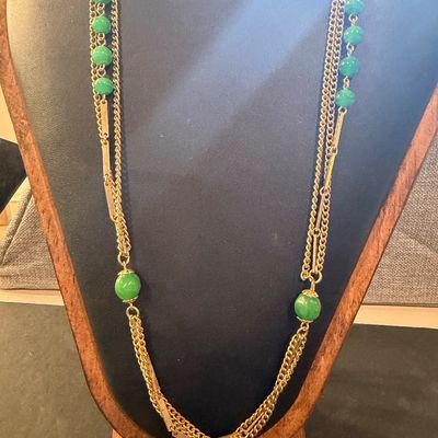 Gold tone multilayer with green beaded accent necklace