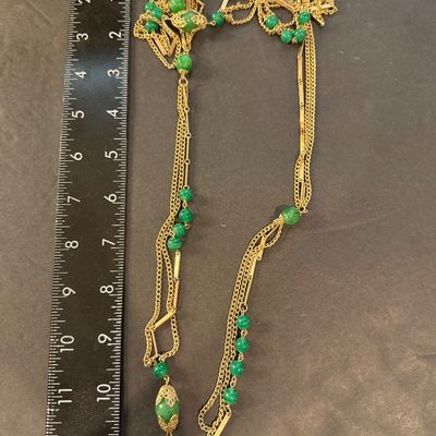 Gold tone multilayer with green beaded accent necklace