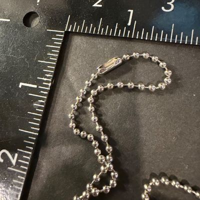 Vintage silver tone cross with blue rhinestone necklace
