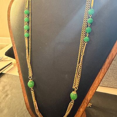 Gold tone multilayer with green beaded accent necklace