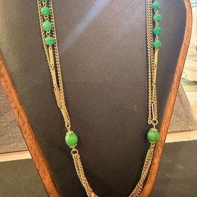 Gold tone multilayer with green beaded accent necklace