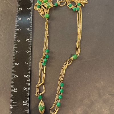 Gold tone multilayer with green beaded accent necklace