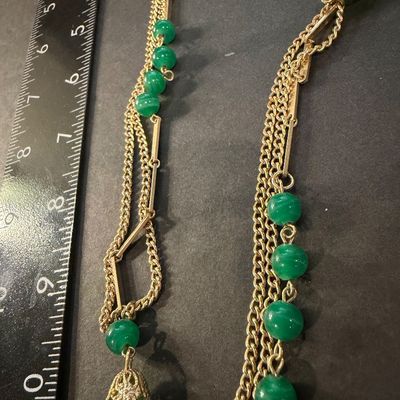 Gold tone multilayer with green beaded accent necklace