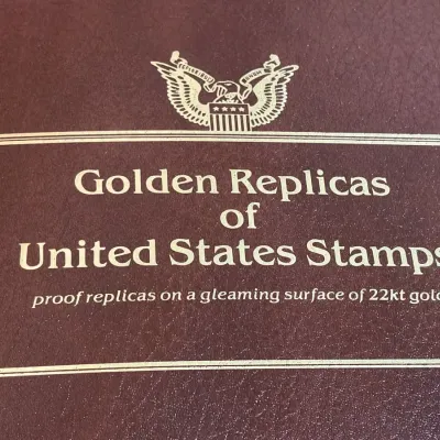 Golden Replicas of United States Stamps in Three Binders