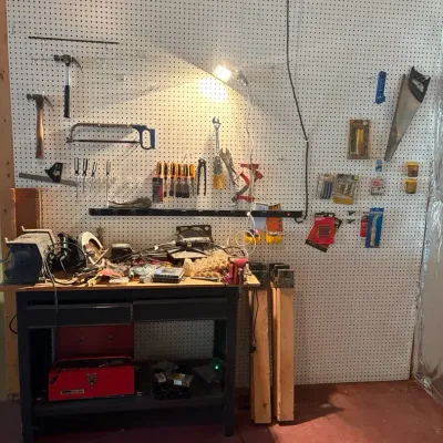 Workbench & Tool Lot – Work Table, Montgomery Ward Grinder, Skilsaw & Hand Tools