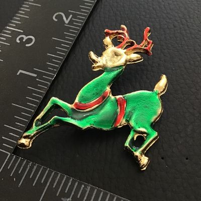 Cute enamel reindeer holiday brooch