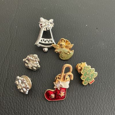 Sale Photo Thumbnail #133: Lot of Vintage Christmas fashion pins 
Please see attached pictures