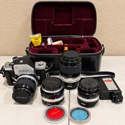 Sale Photo Thumbnail #40: E nikon f4 camera bundle with flash multiple lenses, and carrying case