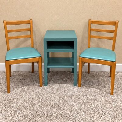 Sale Photo Thumbnail #68: F two wooden chairs with blue cushions and blue side table