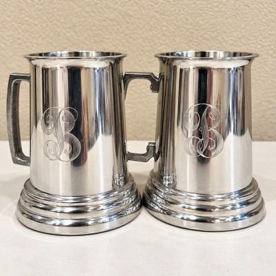 Sale Photo Thumbnail #207: Lk set of two classic silver beer mugs with monogram detailing