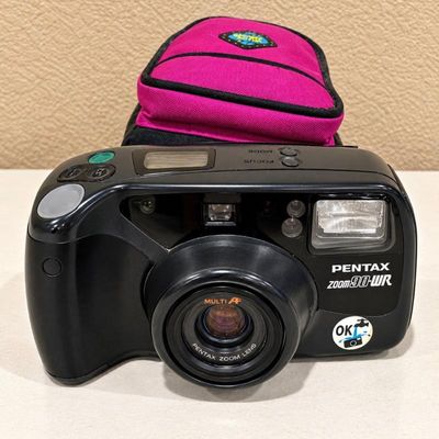 Sale Photo Thumbnail #42: E pentax zoom 90 wr 35mm film camera with storage case