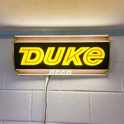 1965 illuminated duke beer advertising bar sign