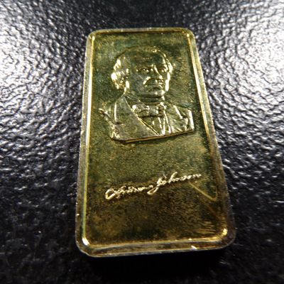 1 OUNCE .999 FINE ANDREW JOHNSON PIERCE SILVER BAR GOLD COLORED