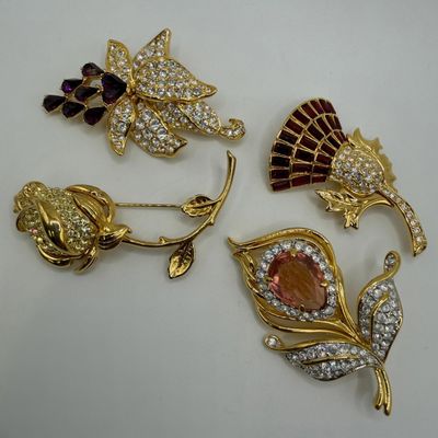 Group of Four Nolan Miller Floral Rhinestone Designer Brooches AB23