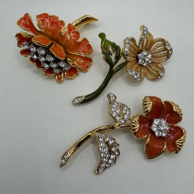 Group of Three Nolan Miller Floral Enamel and White Clear Rhinestone Designer Brooches AB22