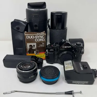 Canon A-1 35mm SLR Camera Outfit w/ Lens, Speedlite 166A Flash + Accessories