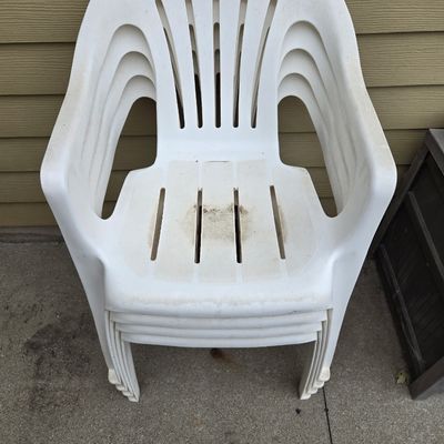 4 white resin chairs