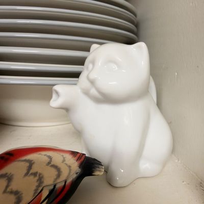 White ceramic cat figurine