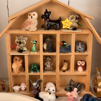 Owl figurine collection in wooden barn curio shelf