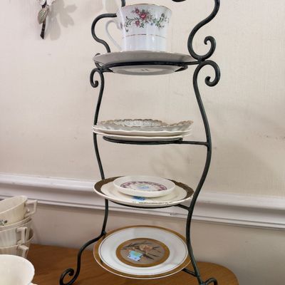 Wrought iron tiered plate stand with china plates