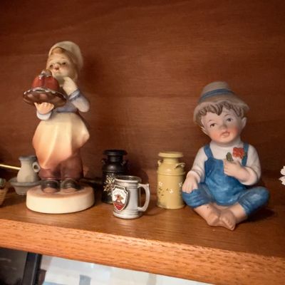 Bisque porcelain boy and girl figurines