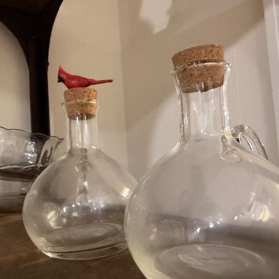 Glass bottles with cork stoppers, cardinal topper