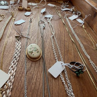 Silver and gold tone chain necklaces, cameo style pendant