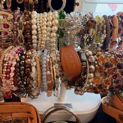 Bracelets on display stand, pearls, beads and cuffs