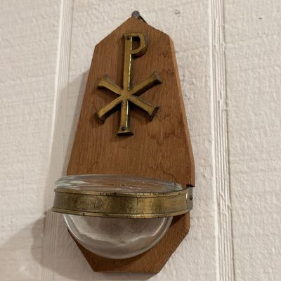Chi Rho wall holy water font, wood and brass