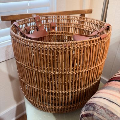 Woven rattan basket with leather handles