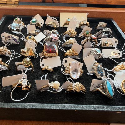 Cocktail rings in display tray, turquoise and quartz stones