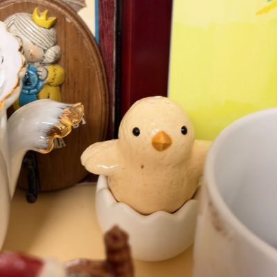 Ceramic chick in eggshell figurine