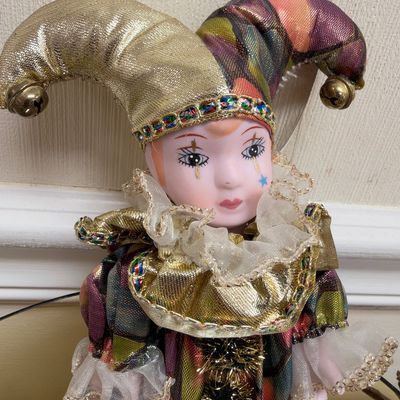 Porcelain face harlequin jester doll