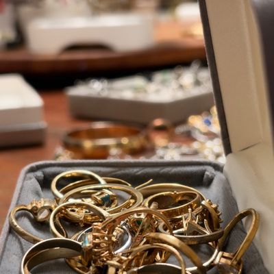 Gold tone bangles and bracelets in jewelry box