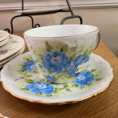 Hand painted blue rose teacup and saucer