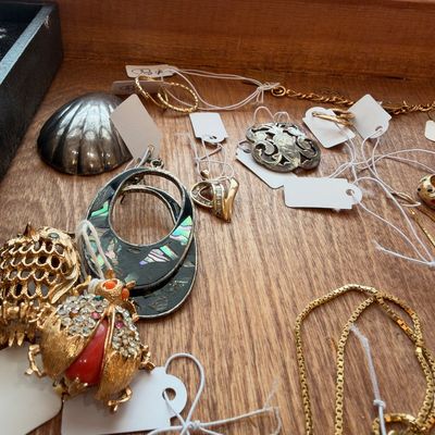 Figural insect brooches and abalone hoop earrings