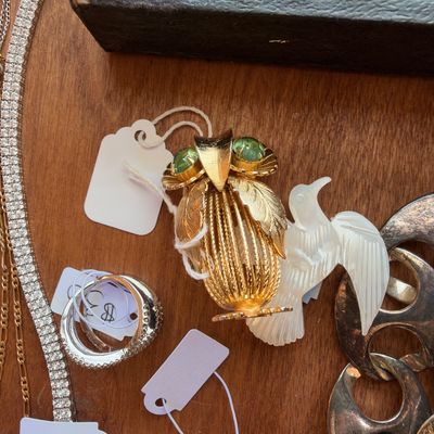 Gold tone owl brooch, white dove pin, rhinestone bracelet