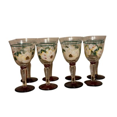 Set of hand-painted glass goblets featuring white floral and green leaf designs with burgundy stems and bases.