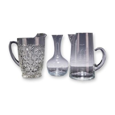 Sale Photo Thumbnail #340: Three Clear Glass Items Including a Nautical Theme Pitcher, a Cut Pattern Pitcher, and a Carafe