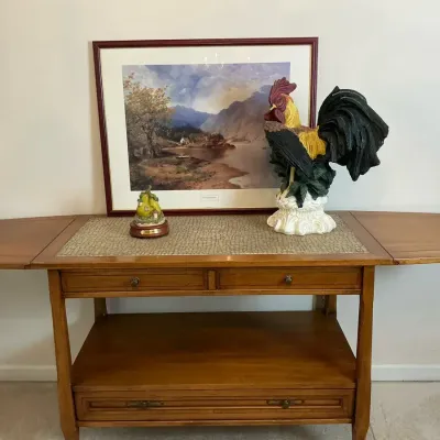 Drop Leaf Serving Cart with Rooster Figurine and Framed Landscape Art