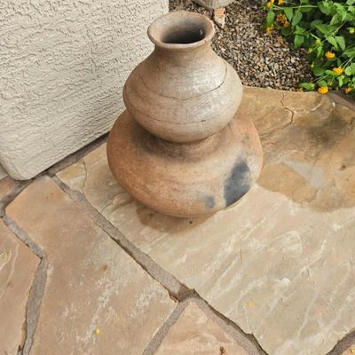Rustic double-chambered terracotta pottery vessel, featuring a natural clay finish with dark fire-clouding marks.