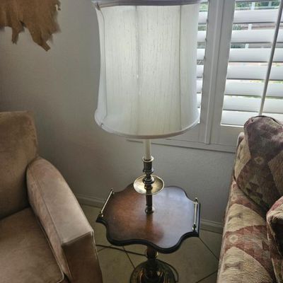 Vintage floor lamp with an integrated scalloped wooden tray table, brass accents, and a tall white fabric shade.