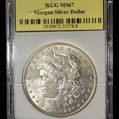 Sale Photo Thumbnail #202: 1897-O MORGAN DOLLAR WCG SUPERB GEM BU