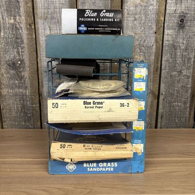 A Collection of Vintage Blue Grass Sandpaper Store Displays and Abrasives